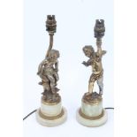 Pair of early 20th century gilt spelter lamps in the form of putti, one signed - Ang.