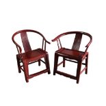 Near pair of Chinese red lacquer horseshoe chairs, each with carved rectangular panel back,