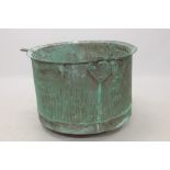 Extremely large antique riveted copper vessel with everted rim,