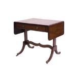 Regency mahogany sofa table of small size, the crossbanded drop-leaf top above frieze drawer,