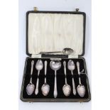 Set of six plus one contemporary silver teaspoons and matching sugar spoon with embossed floral