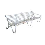 19th century wrought iron bench of large size, slatted construction on scrolled supports,