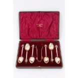 Unusual set of six Edwardian silver teaspoons and matching sugar tongs with silver gilt bowls and