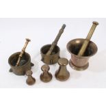 Pair 18th century brass mortars with finned sides and two pestles,