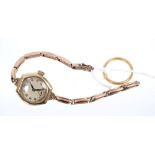 Gold (22ct) wedding ring and a ladies' gold cased wristwatch on expandable bracelet