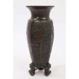 Early 20th century Japanese bronzed vase of slender octagonal baluster form, with everted rim,
