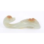 Chinese carved green jade buckle in the form of a dragon, a russet inclusion carved as a bat,