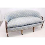 Late 19th / early 20th century twin seater sofa of bowed form,