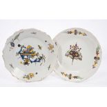 Two 18th century French faience plates painted with buildings, flora and insects,