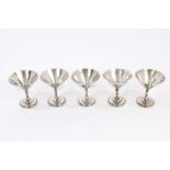 Five 1920s / 1930s Chinese white metal dishes of flared conical form, with hand-beaten finish,