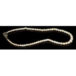 Antique pearl necklace with a string of graduated pearls (not tested for natural origin) on an