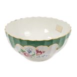 18th century Worcester fluted bowl with polychrome painted floral sprays and apple-green border -