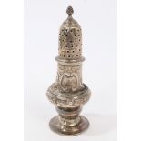 George III silver caster of baluster form, with later embossed scroll and foliate decoration,