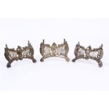 Three late Victorian silver menu holders with pierced grid decoration and scrolling border,