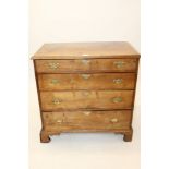 Early 18th century walnut and oak country chest with four graduated drawers,