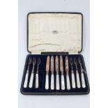 Part set of silver fruit knives and forks with mother of pearl handles,