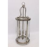 Modern chrome cylindrical four-height lantern with glazed outer and suspension ring,