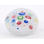French Baccarat glass paperweight with scattered millefiori canes on upset muslin ground,