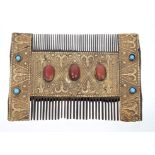 Unusual Eastern hair comb with embossed yellow metal mounts,