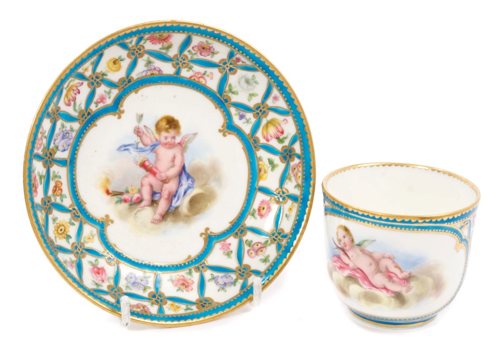 19th century Sèvres porcelain cup and saucer with painted cherub reserves with turquoise and gilt