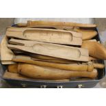 Suitcase containing several pairs of vintage wooden hunting boot trees