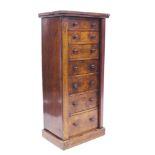 Victorian walnut Wellington chest with seven graduated drawers and lockable stile on plinth,