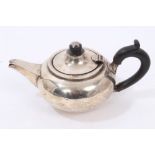 George V silver bachelors teapot of compressed form,