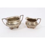 Edwardian silver cream jug and matching two-handled sugar bowl of half fluted form,