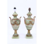 Pair onyx urn-shaped table lamps with gilt metal swag and wreath mounts on square socles,