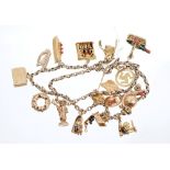 Gold charm necklace with a good collection of eighteen gold (9ct) and yellow metal novelty charms