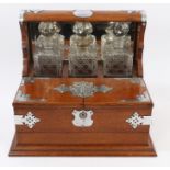 Edwardian oak framed tantalus / cigar / gaming box with silver plated mounts,