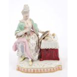 Late 19th century Meissen porcelain figure of a lady seated at her dressing table,