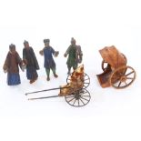 Four late 19th century Chinese carved wood and polychrome painted figures of peasants and