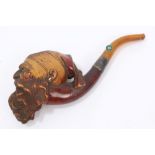 19th century meerschaum pipe carved with a Turk's head in cap with amber mouthpiece, in fitted case,