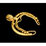 Ancient Byzantine gold lunette pendant of crescent form, with gold bead and wirework decoration,