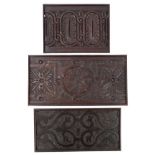Three 17th century carved oak panels, each with geometric carved ornament,