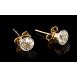 Pair diamond single stone earrings, each with an old cut diamond in millegrain platinum setting,