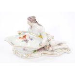 19th century Vienna porcelain table ornament of a reclining female figure with open dish,