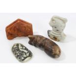 Chinese mottled jade or hardstone carving in the stylised form of a cat, 7cm long,
