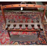 Late Victorian mahogany whip and boot rack with brass handle,