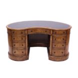 Gillows-style walnut kidney-shaped pedestal desk with leather inset writing surface and nine