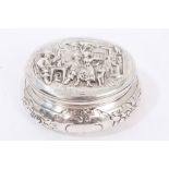 Continental silver trinket box of oval form, with embossed floral decoration,