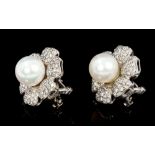 Pair cultured pearl and diamond earrings, each designed as a flower with a central 8.3mm to 8.