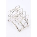 Edwardian silver four-division toast rack with angular frame,