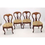 Set of four Victorian mahogany balloon back chairs, each with floral stuffover seat,