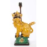 Chinese Dog of Fo with yellow glaze and green glazed pedestal fitted as a table lamp,