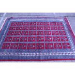 Eastern design carpet with five rows of repeat vase motif within multiple borders,