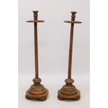 Pair of antique elm ecclesiastical candle stands,