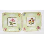 Pair early 19th century Coalport green ground square dessert dishes with painted and moulded floral