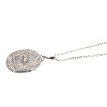 Victorian silver oval locket with embossed design depicting a heron amongst foliage,